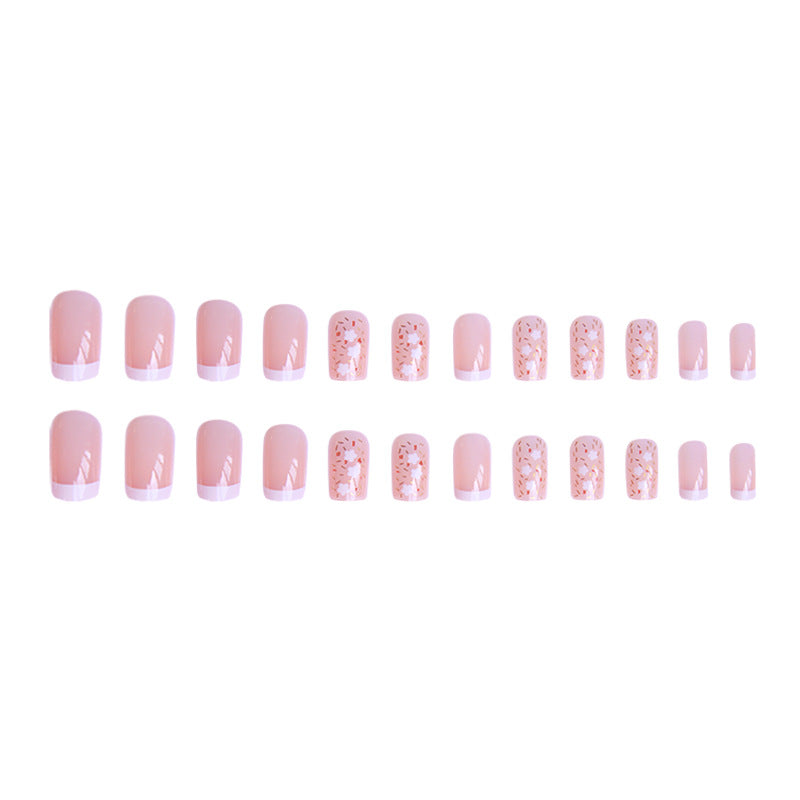 Kunstnagelset mit floralen Verzierungen und elegantem französischen Design Brehn