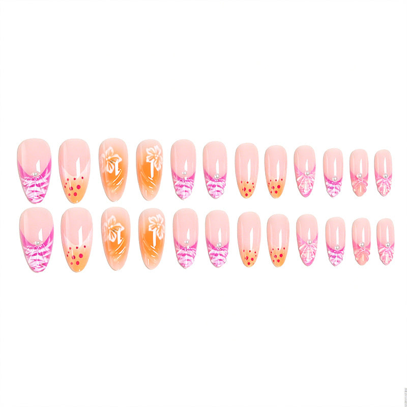 Kunstnagelset mit exotischen Blumenmustern und Glitzerakzenten Brehn