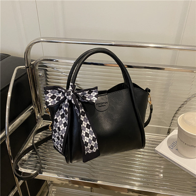 Elegante Schleifenakzent-Handtasche Brehn