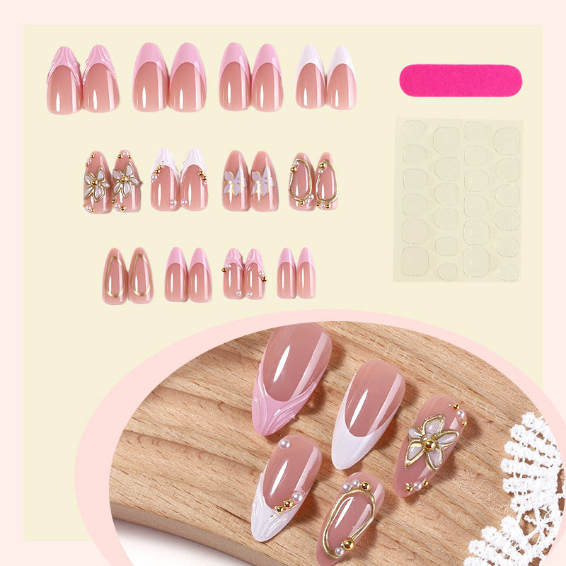 Dekorativer Press-On Nagelset mit floralen Designs Brehn