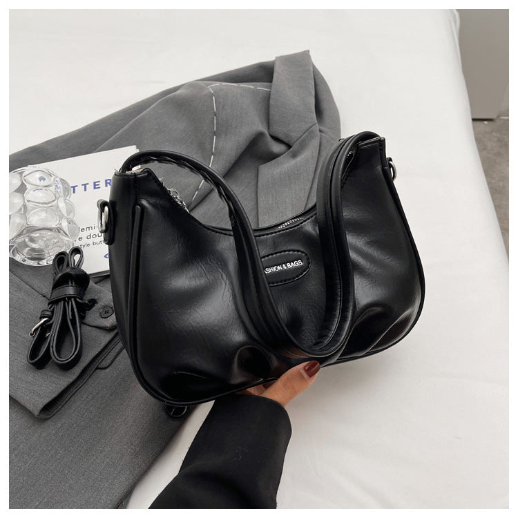 Moderne Kurven-Schultertasche Brehn