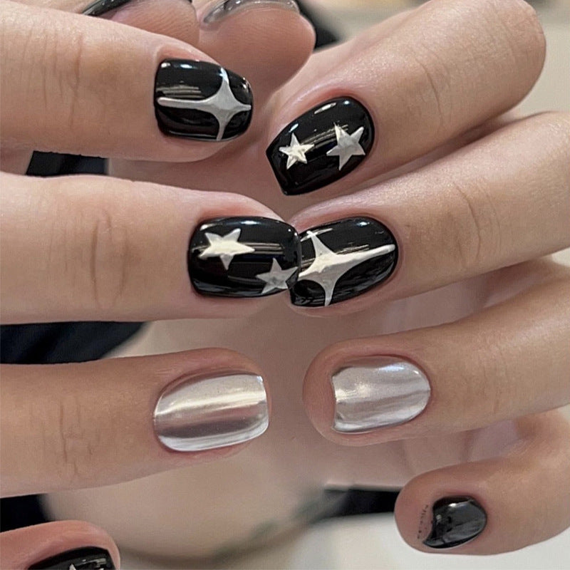 Künstlerisches Press-On-Nagelset mit metallischen Stern-Designs Brehn