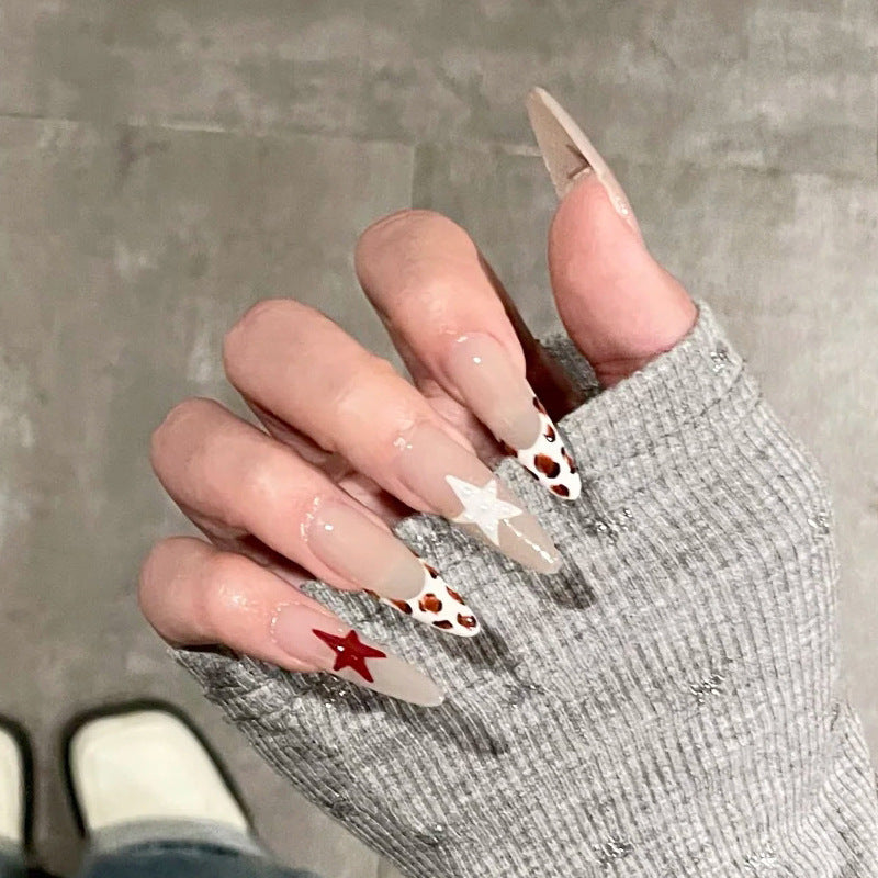 Künstlerische Stiletto Press-On Nägel mit Stern- und Tiermustern Brehn