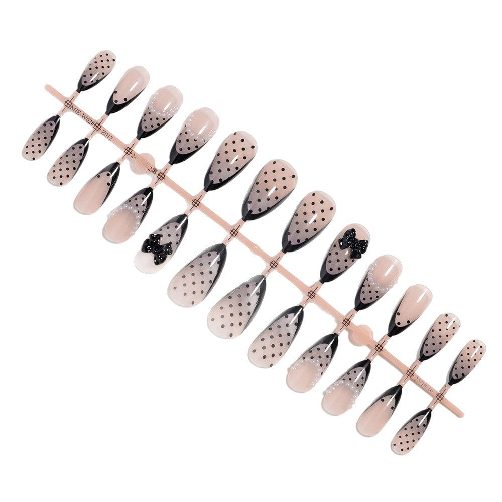 Elegante Polka Dot Drucknägel mit Schleifenakzenten Brehn
