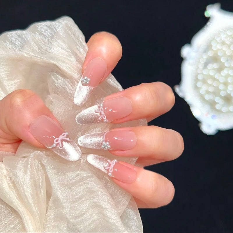 Kunstnagelset mit eleganten Schleifen- und Strassverzierungen Brehn