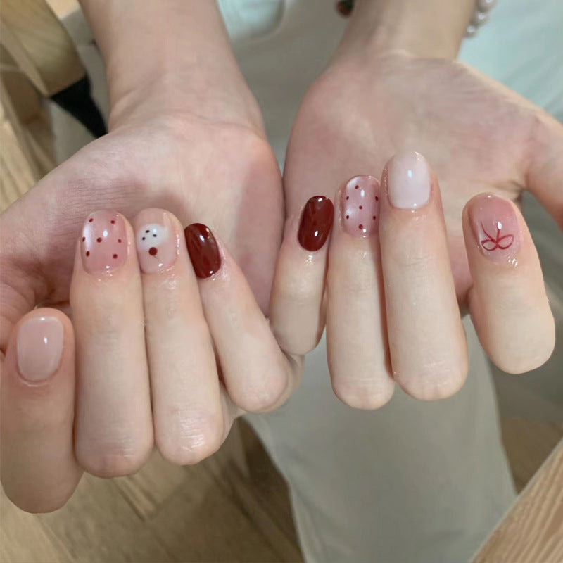 Künstlerisches Press-On Nagelset mit verspieltem Punkte- und Schleifendesign Brehn