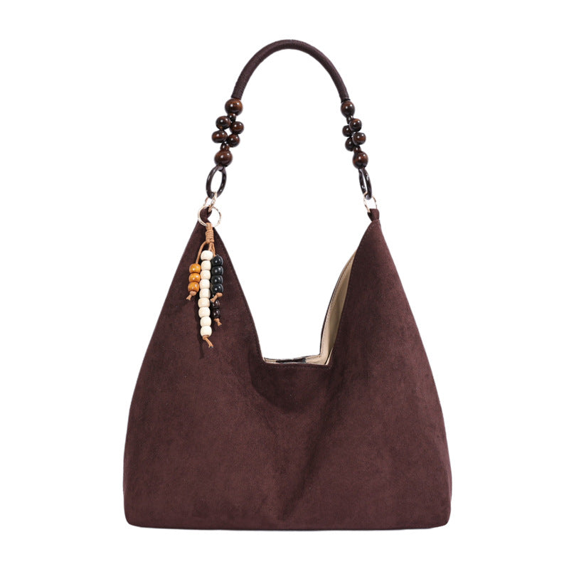 Stylische Hobo-Handtasche mit Perlenriemen