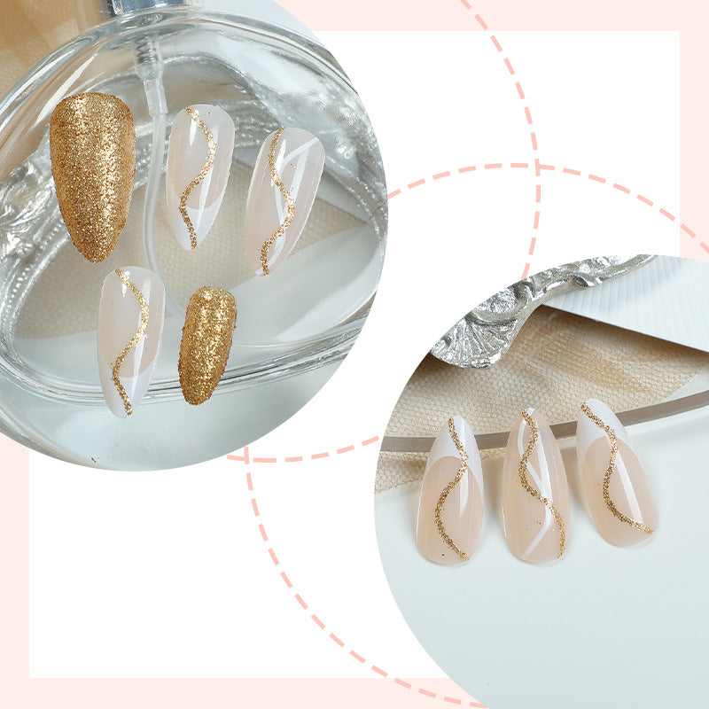 Elegantes Press-On-Nail-Set mit Glitzer und goldenen Wirbelakzenten Brehn