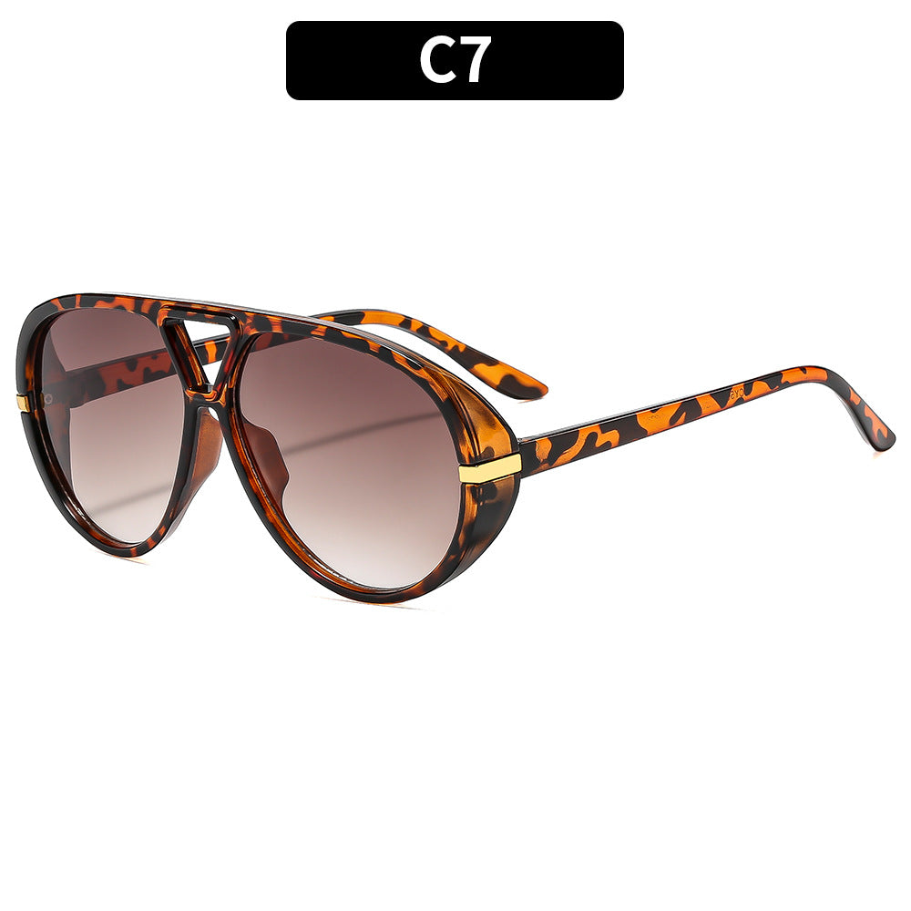Oversized Shield-Sonnenbrille mit dekorativen Akzenten