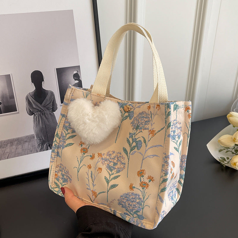 Blumenverzierte Tasche