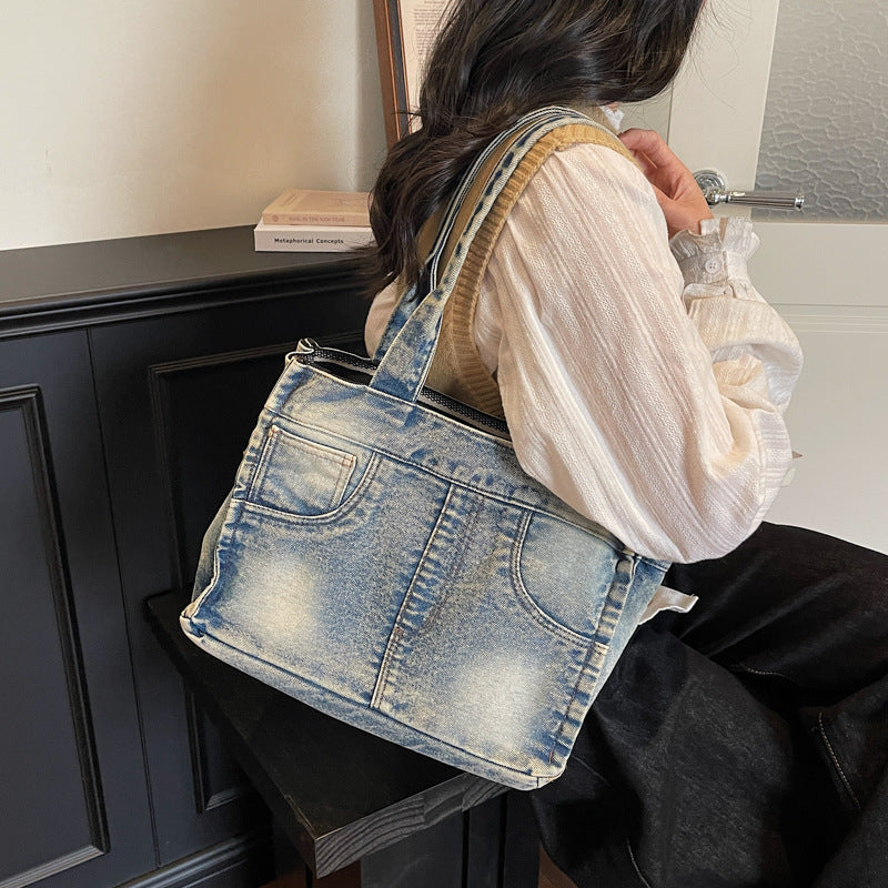 Denim-inspirierte Mehrfach-Taschen Tote Bag