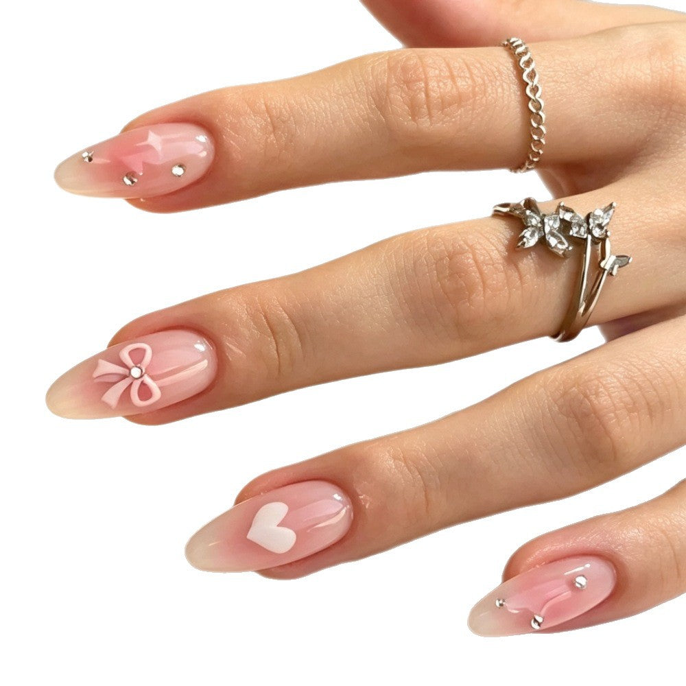 Dekorative Press-On Nagelkunst Set mit Herz- und Schleifendesigns Brehn