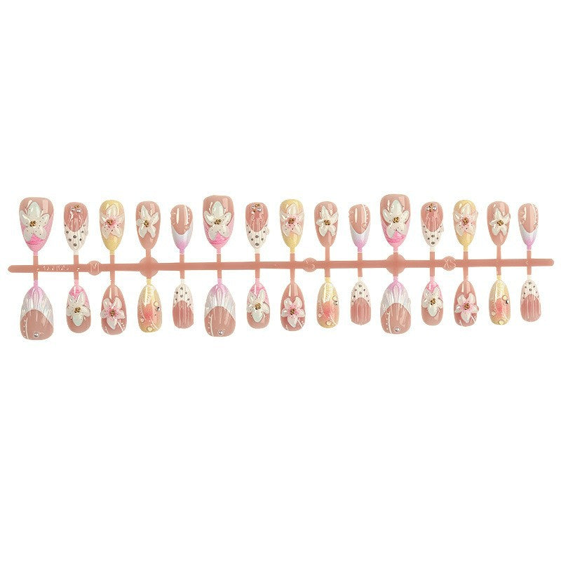 Kunstnagelset mit eleganten floralem Design und Glitzerakzenten Brehn