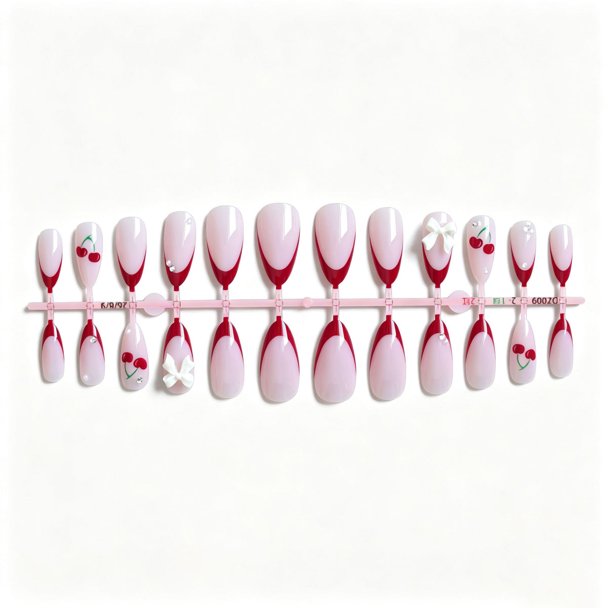 Künstlerisches Kirsch- und Schleifen-Nageldesign
