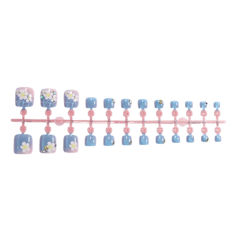 Kunstnagelset mit floralen Applikationen und Glitzereffekten Brehn