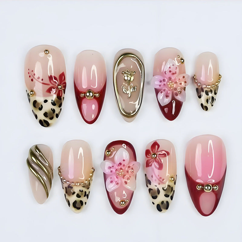 Kunstnagelset mit eleganten floralen und tierischen Akzenten Brehn