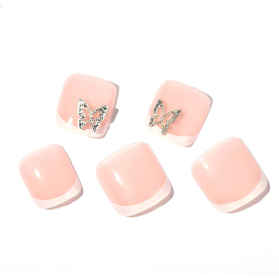 Kunstnagelset mit zarten Dekorationen und Glitzer-Motiven Brehn