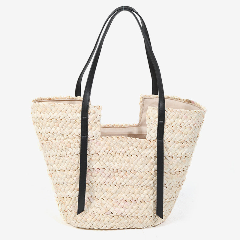 Damen Handtasche aus geflochtenem Naturmaterial mit eleganten Ledergriffen Brehn