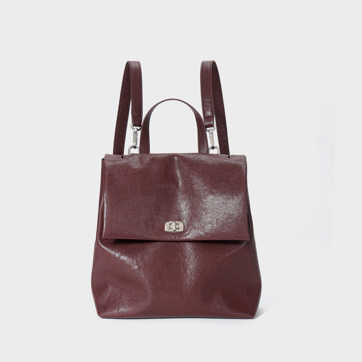 Umwandelbare Leder Klappen-Rucksack-Handtasche mit Obergriff und Drehverschluss