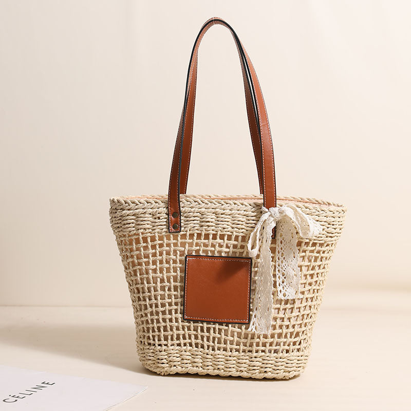 Damen Korbtasche mit eleganten Lederdetails und verspieltem Schleifenakzent Brehn