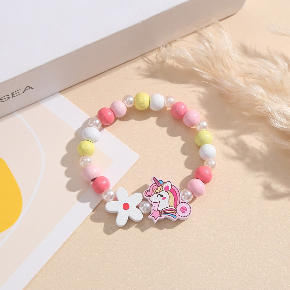 Verspieltes Kinderarmband mit Einhorn- und Blumenmotiv Brehn