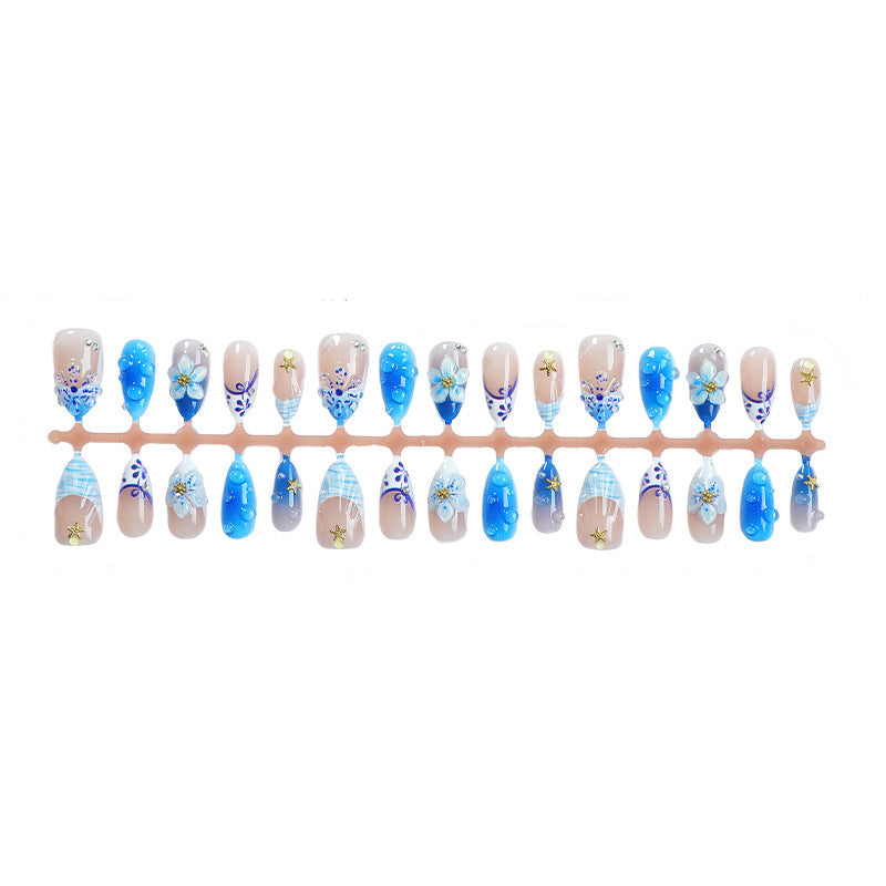 Kunstnagelset mit maritimen Motiven und floralem Design Brehn