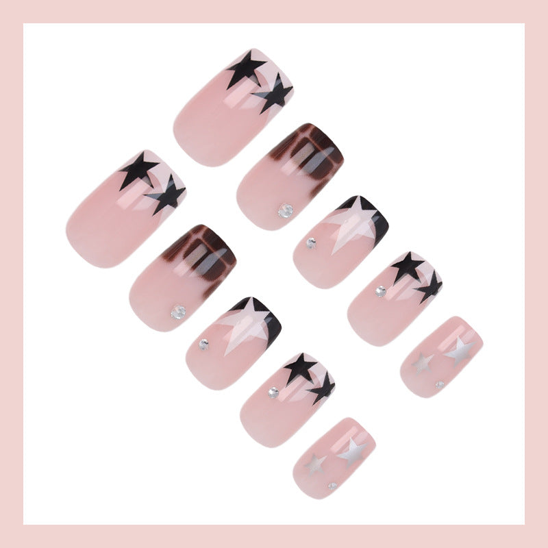 Kunstnagelset mit glamourösen Sternen- und Glitzerakzenten Brehn