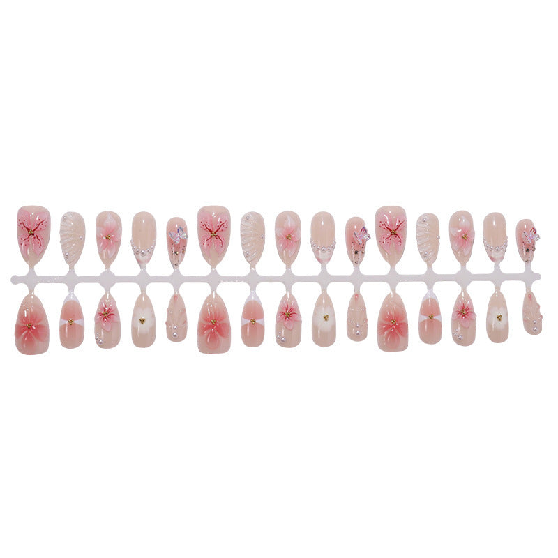 Kreatives Kunstnagelset mit filigranen Blüten- und Glitzerverzierungen Brehn