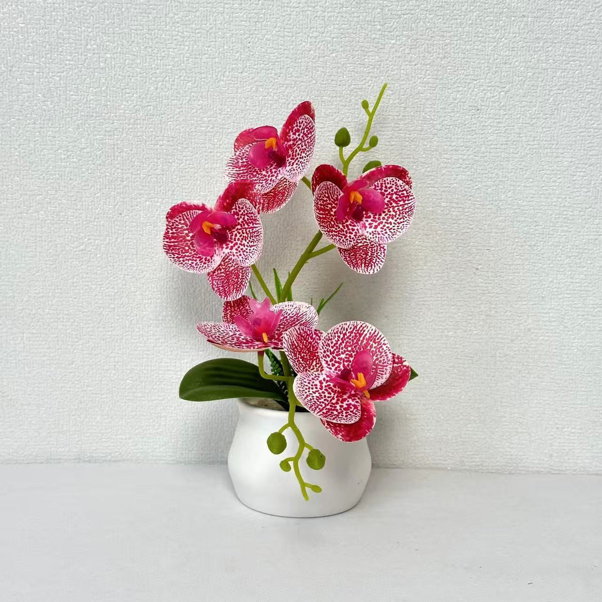 Elegante künstliche Orchideenpflanzenarrangement für die Wohnkultur