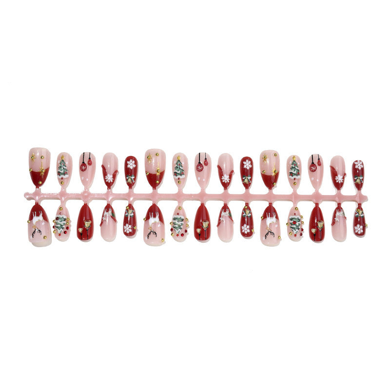 Kunstnagelset mit festlichen Weihnachtsmotiven und funkelnden Akzenten Brehn