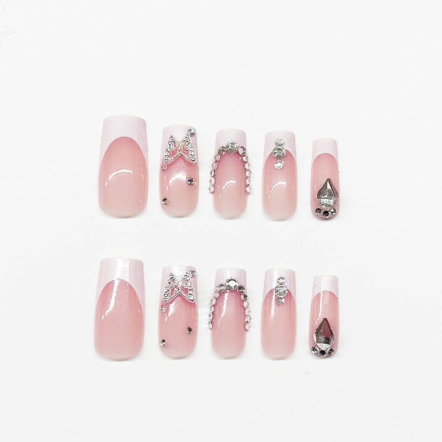 Kunstnagelset mit eleganten Strass- und Glitzerverzierungen Brehn