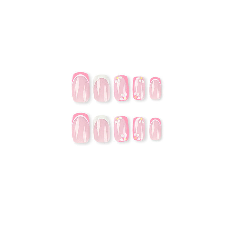 Kunstvolle Nagelkunst mit floralem Design und Glitzerakzenten Brehn