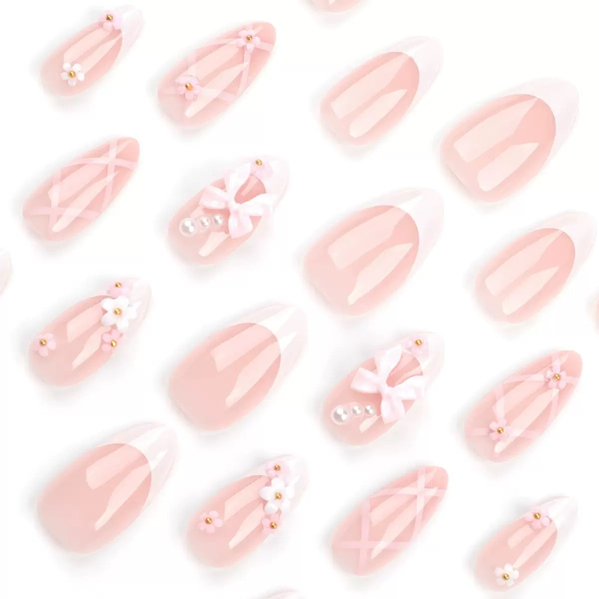 Kunstnagelset mit eleganten Schleifen und floralen Akzenten Brehn