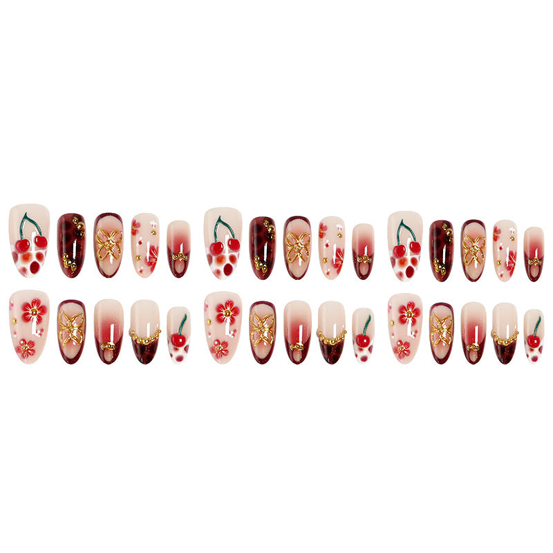 Kunstvolle Nagelspitzen mit fröhlichen Blumen- und Kirschdesign Brehn