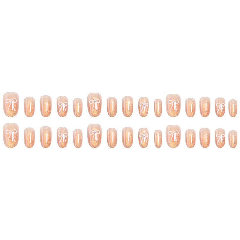 Glamouröse Kunstnagelspitzen mit Glitzerakzenten Brehn