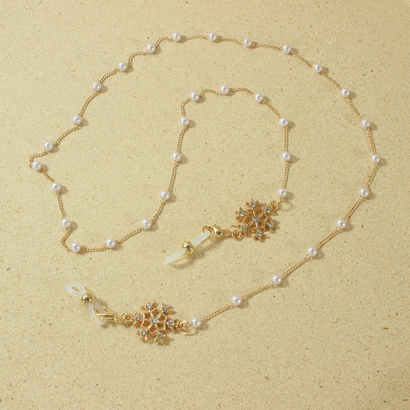 Elegante Brillenhalterkette mit Perlen und Schneeflockenanhänger Brehn