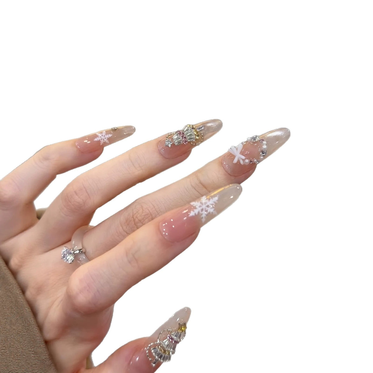 Dekoratives Stiletto Press-On Nagelkunst-Set mit Schneeflocken- und Edelsteinakzenten Brehn