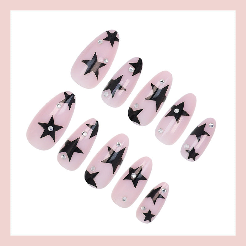 Kunstnagelset mit glamourösen Sternen und funkelnden Akzenten Brehn