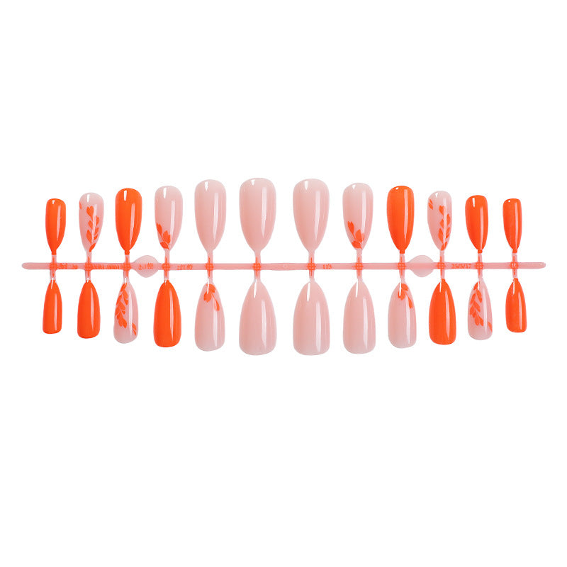 Künstlerisches Press-On Nail Set mit saisonalen floralen Designs Brehn