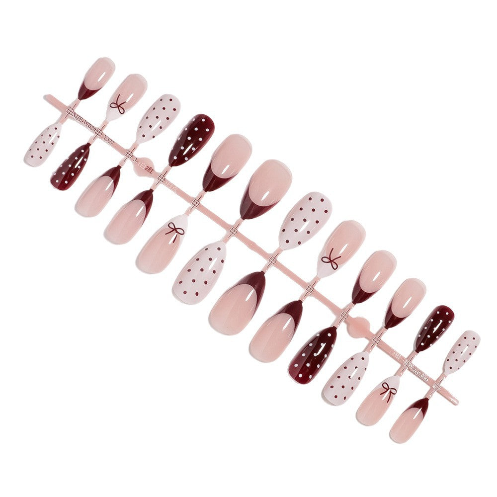 Künstlerisches Press-On-Nagelset mit Schleifen- und Punktdesign Brehn