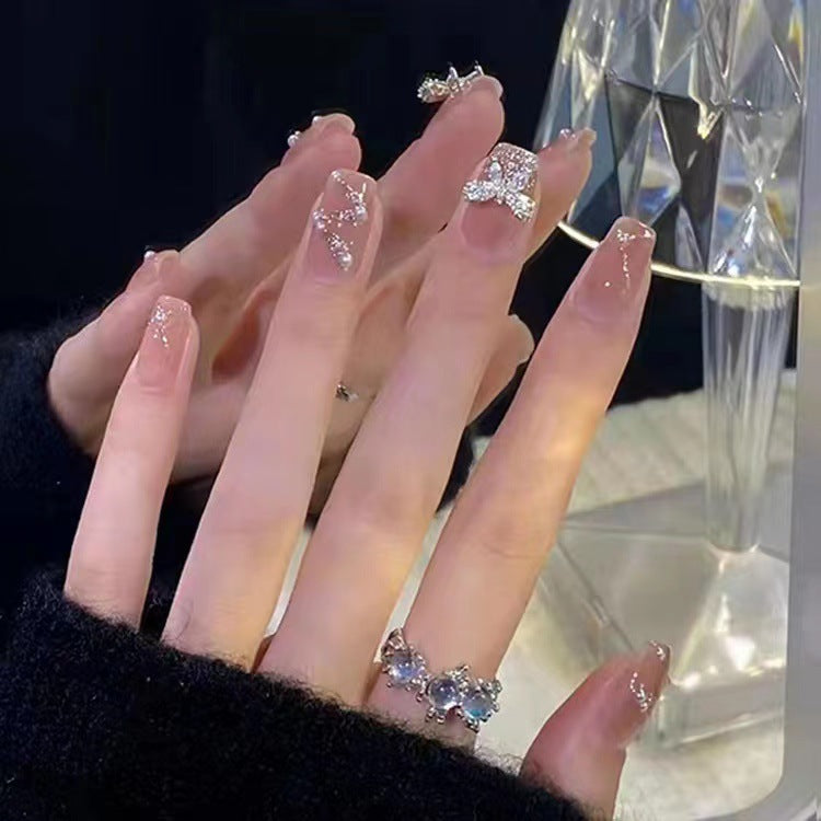 Glamouröse Glitter-Kunstnägel mit Schmetterlingselement Brehn