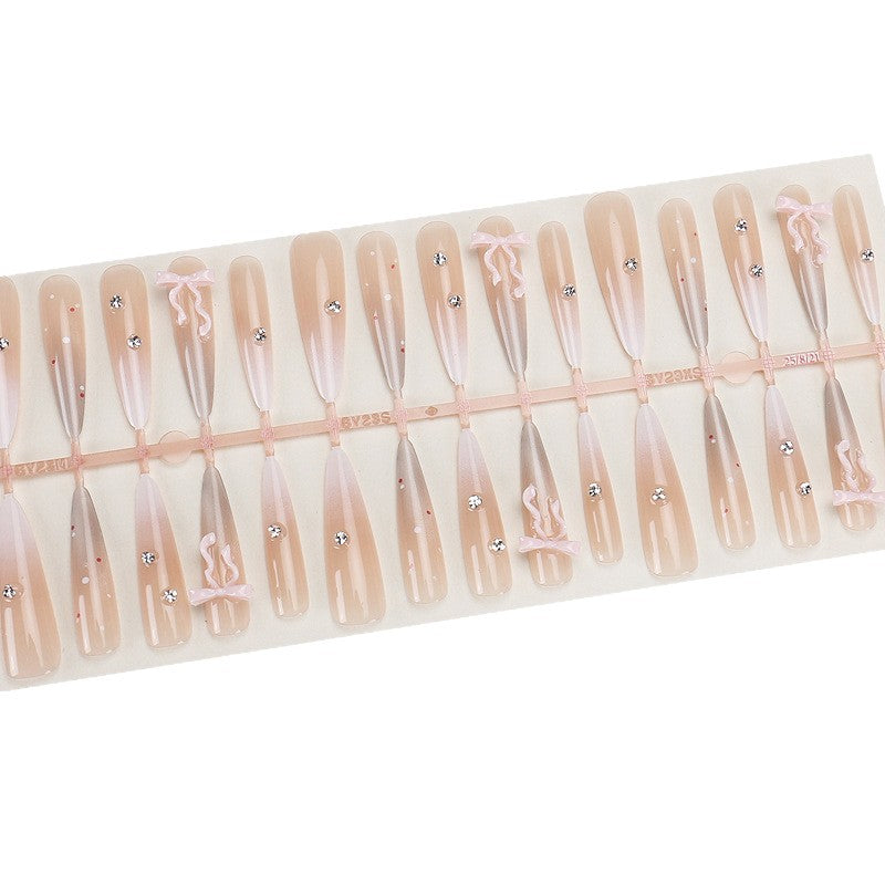 Elegante Stiletto Press-On Nägel mit dekorativem Bogen und Strassakzenten Brehn