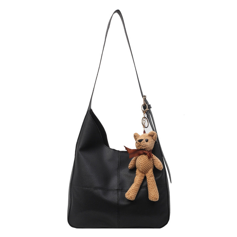 Lederhandtasche mit Teddy-Anhänger