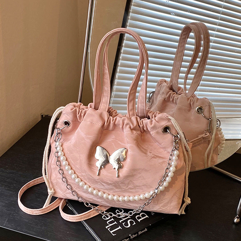 Elegante Mini-Handtasche mit Perlenakzenten und Kordelzug