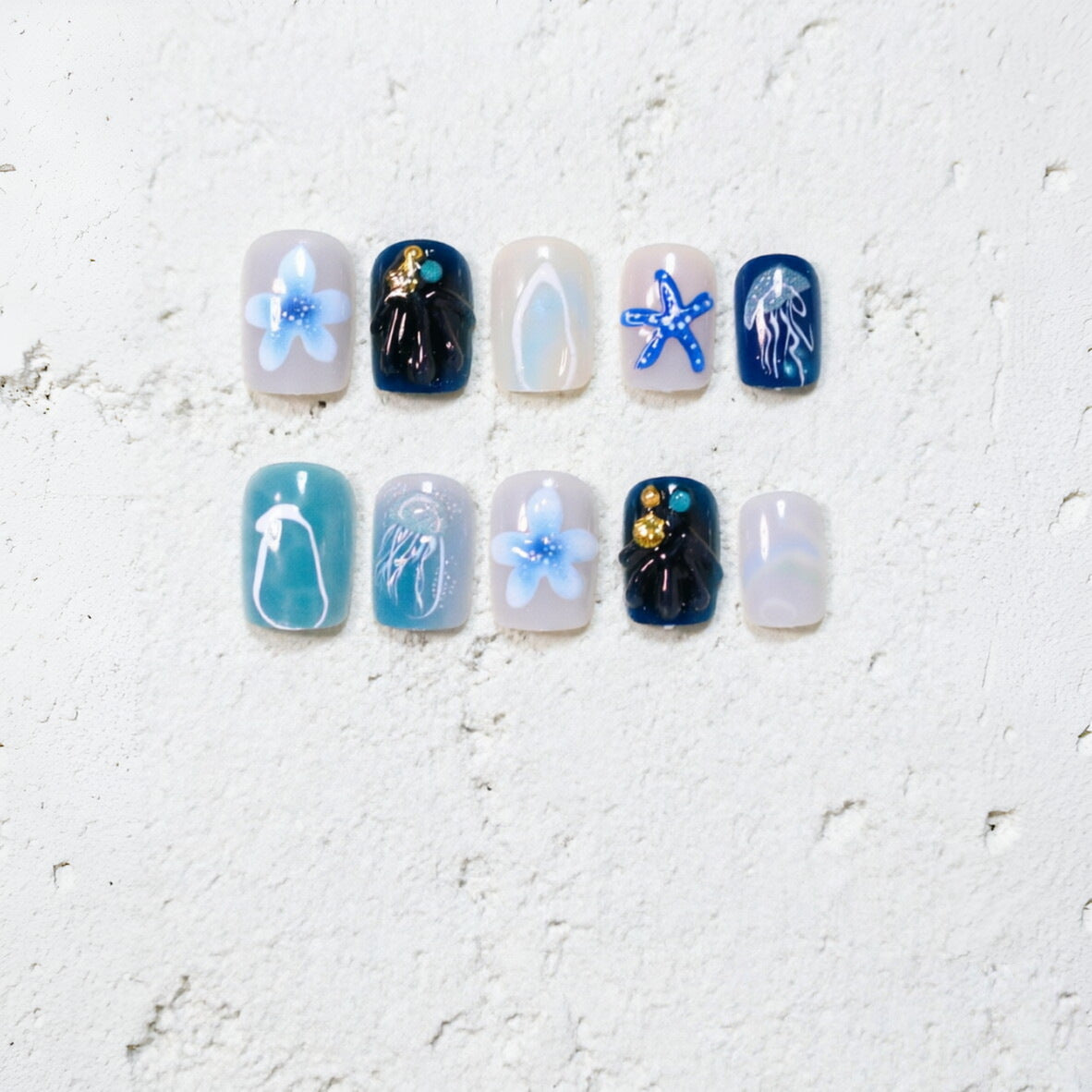 Ozean-inspiirertes künstlerisches Press-On-Nageldesign Brehn