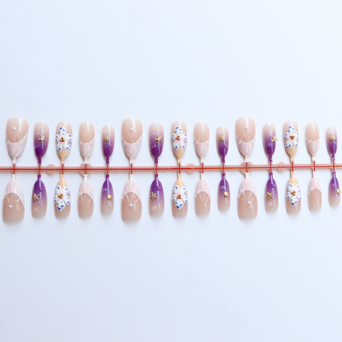 Dekoratives Press-On Nagelkunst Set mit floralen und ozeanischen Themen Brehn
