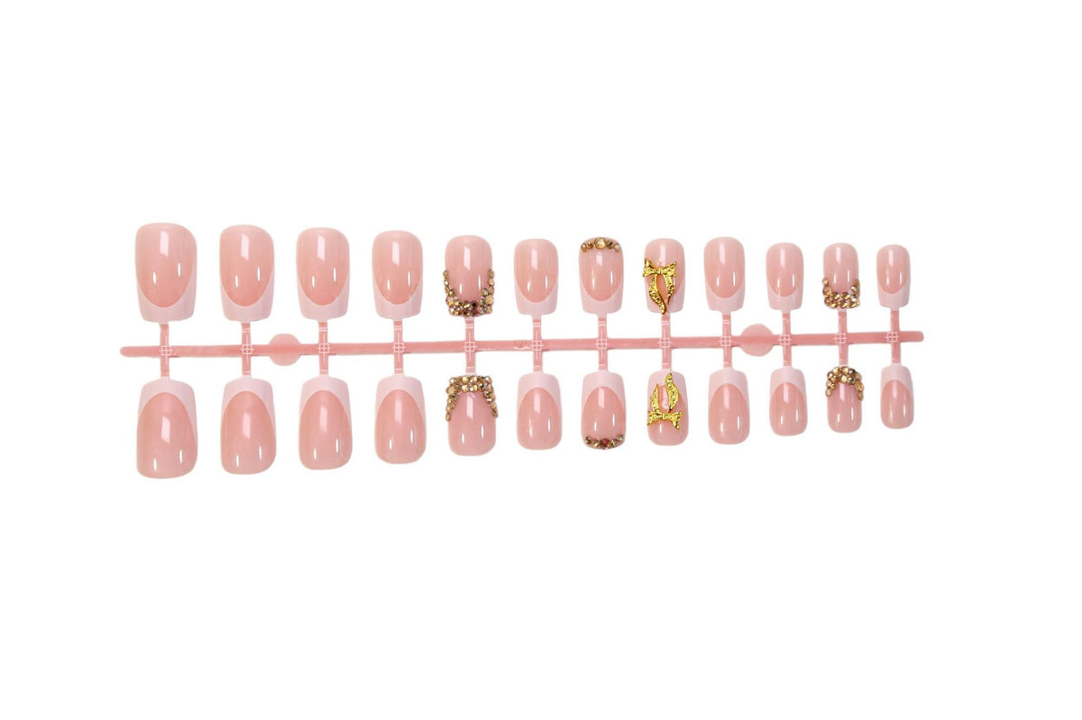 Kunstnagelset mit eleganten Glitzerornamenten und stilvollen French-Tipps Brehn