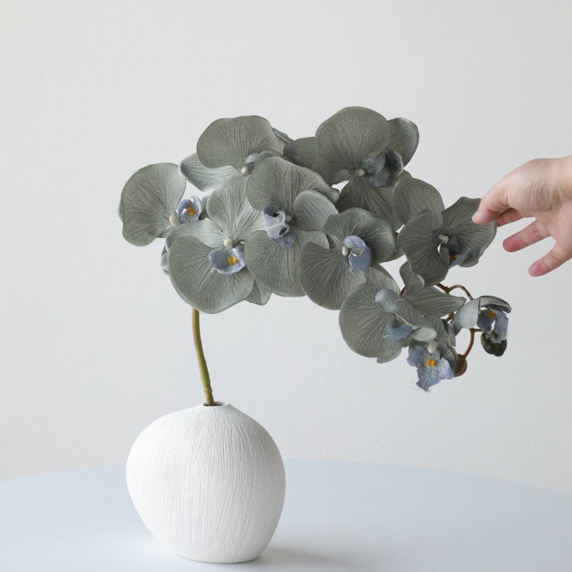 Elegante künstliche Orchideenarrangement
