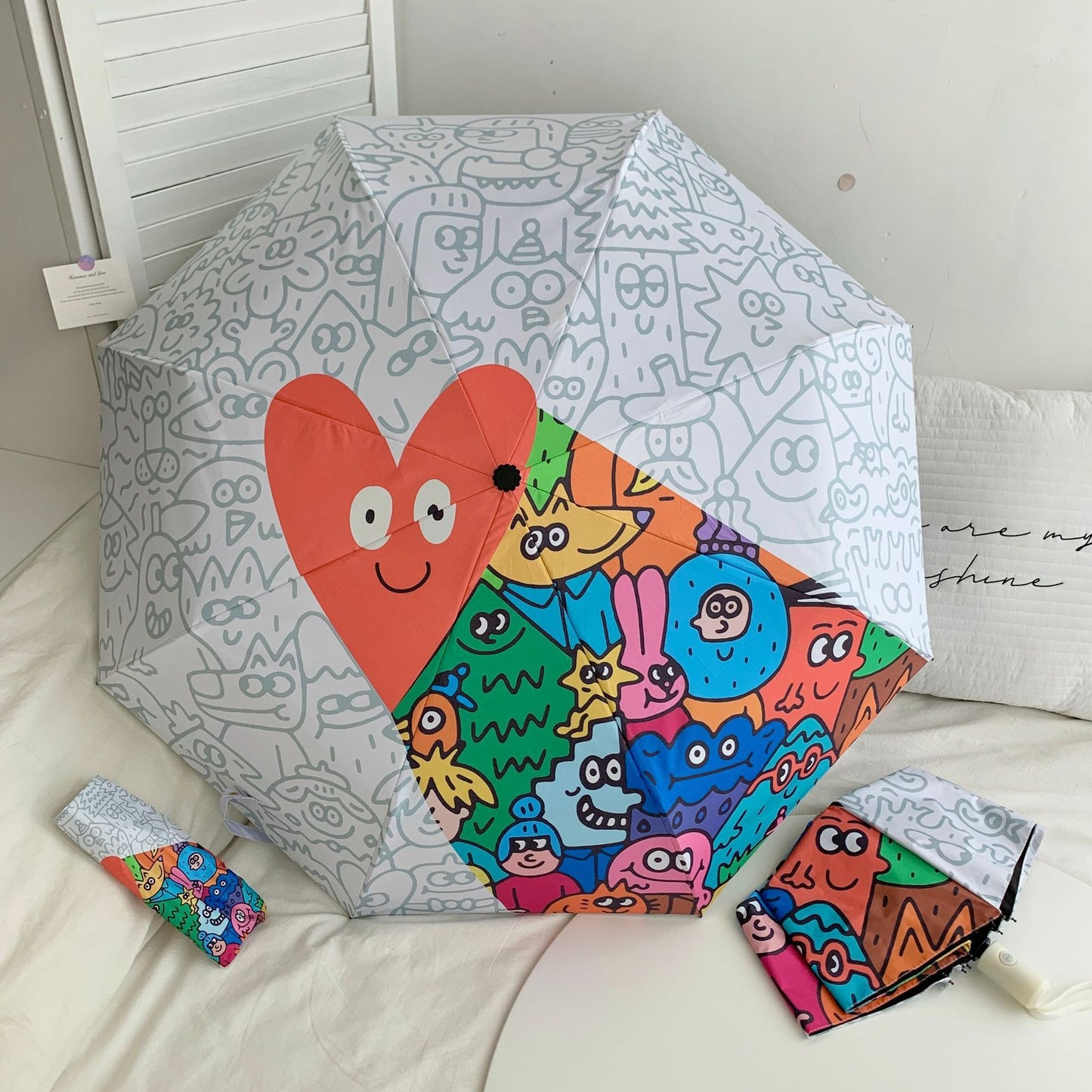 Damen Faltregenschirm mit bunten Comic-Motiven Brehn