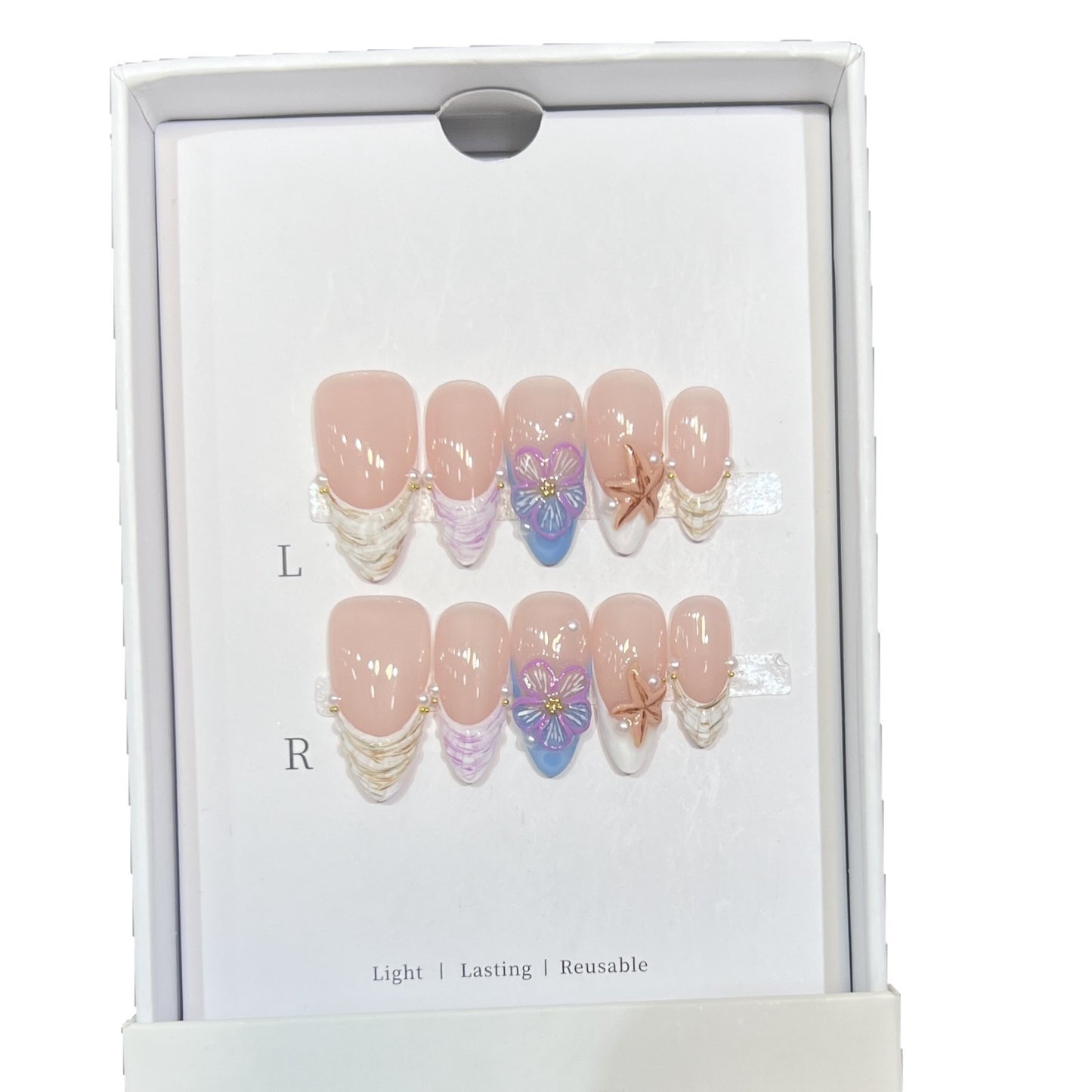 Künstlerisches Press-On Nagelkunst Set mit floralem und Seestern Design Brehn